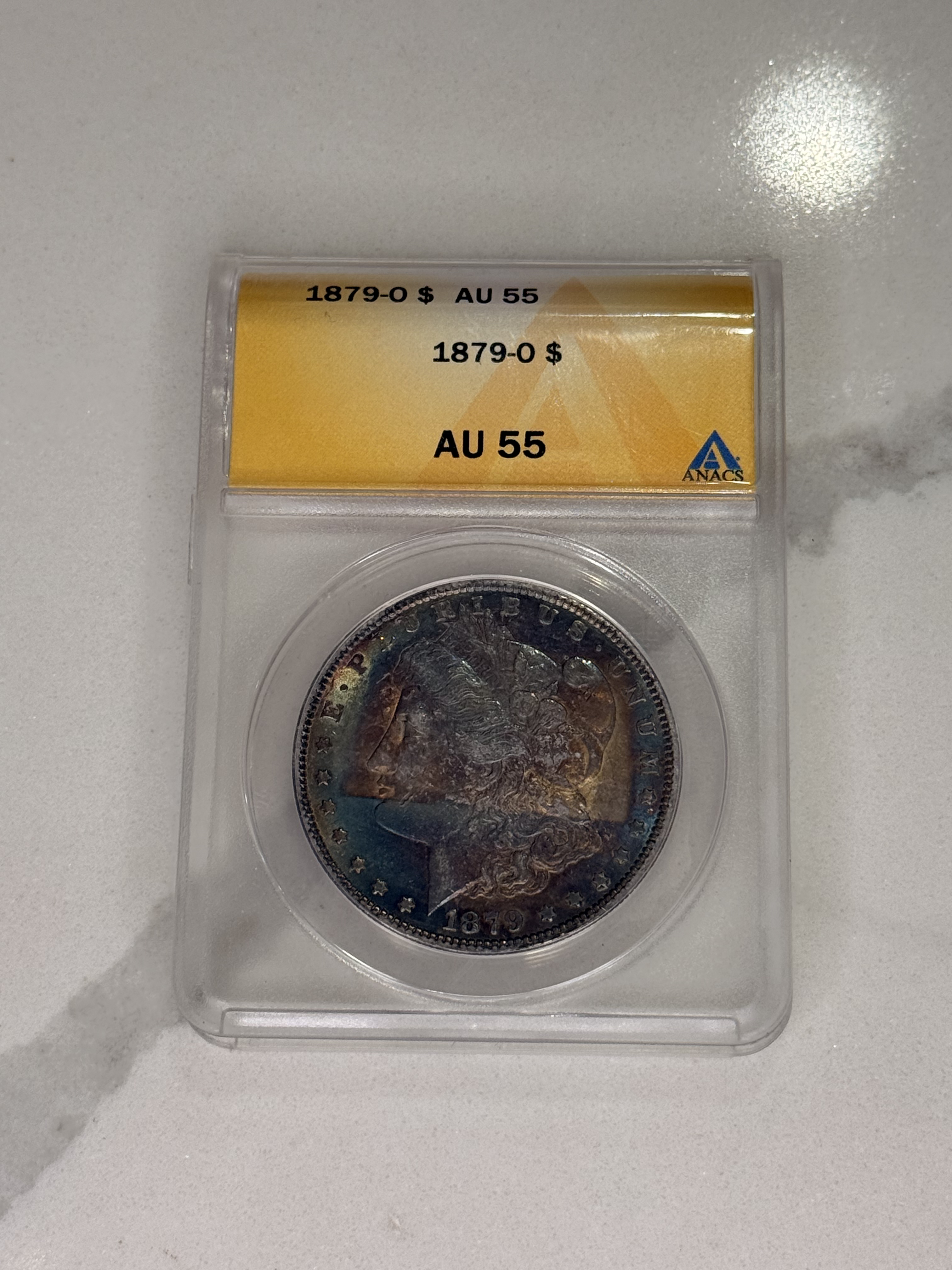 Actual coin and holder — front