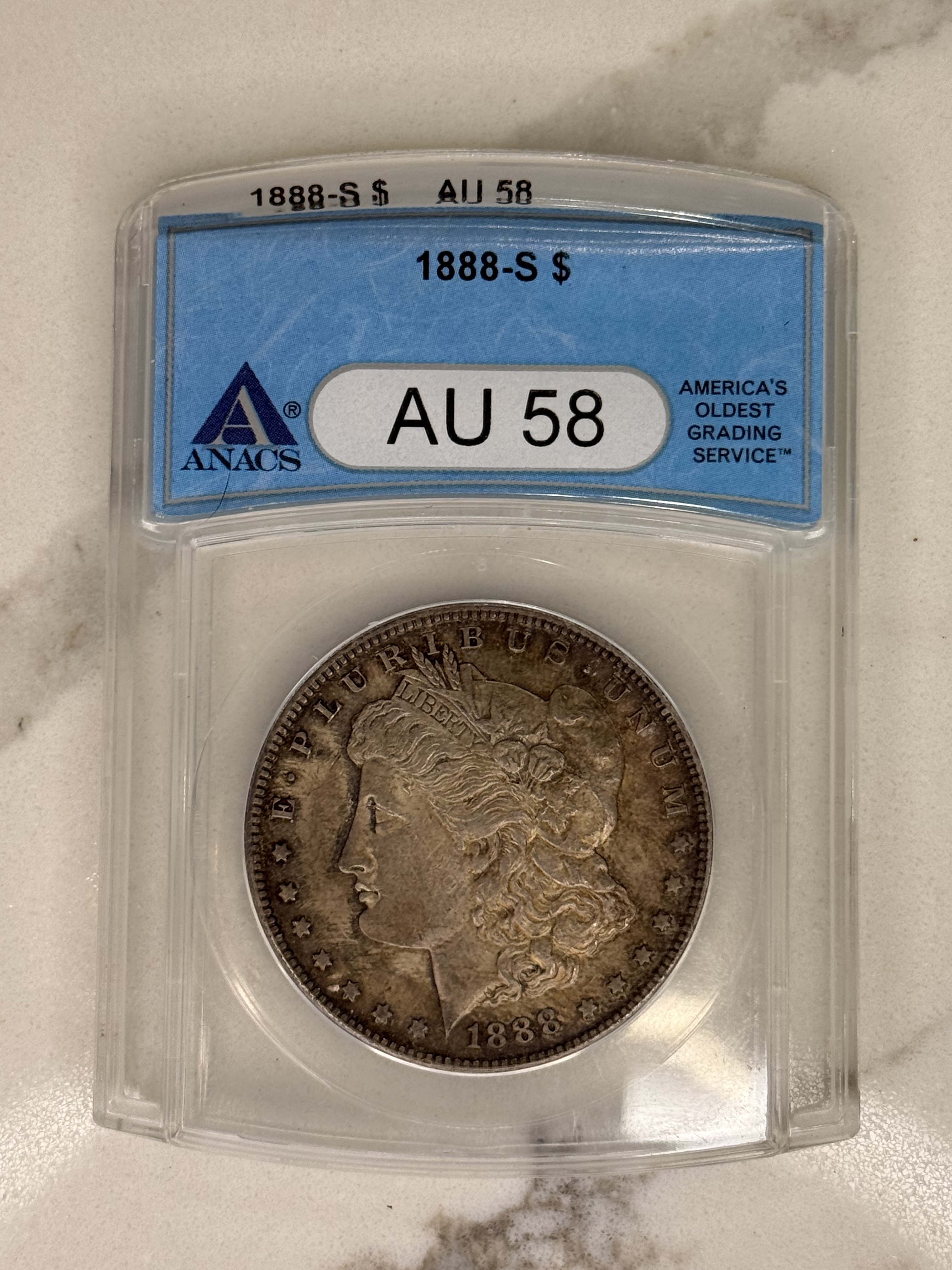 Actual coin and holder — front