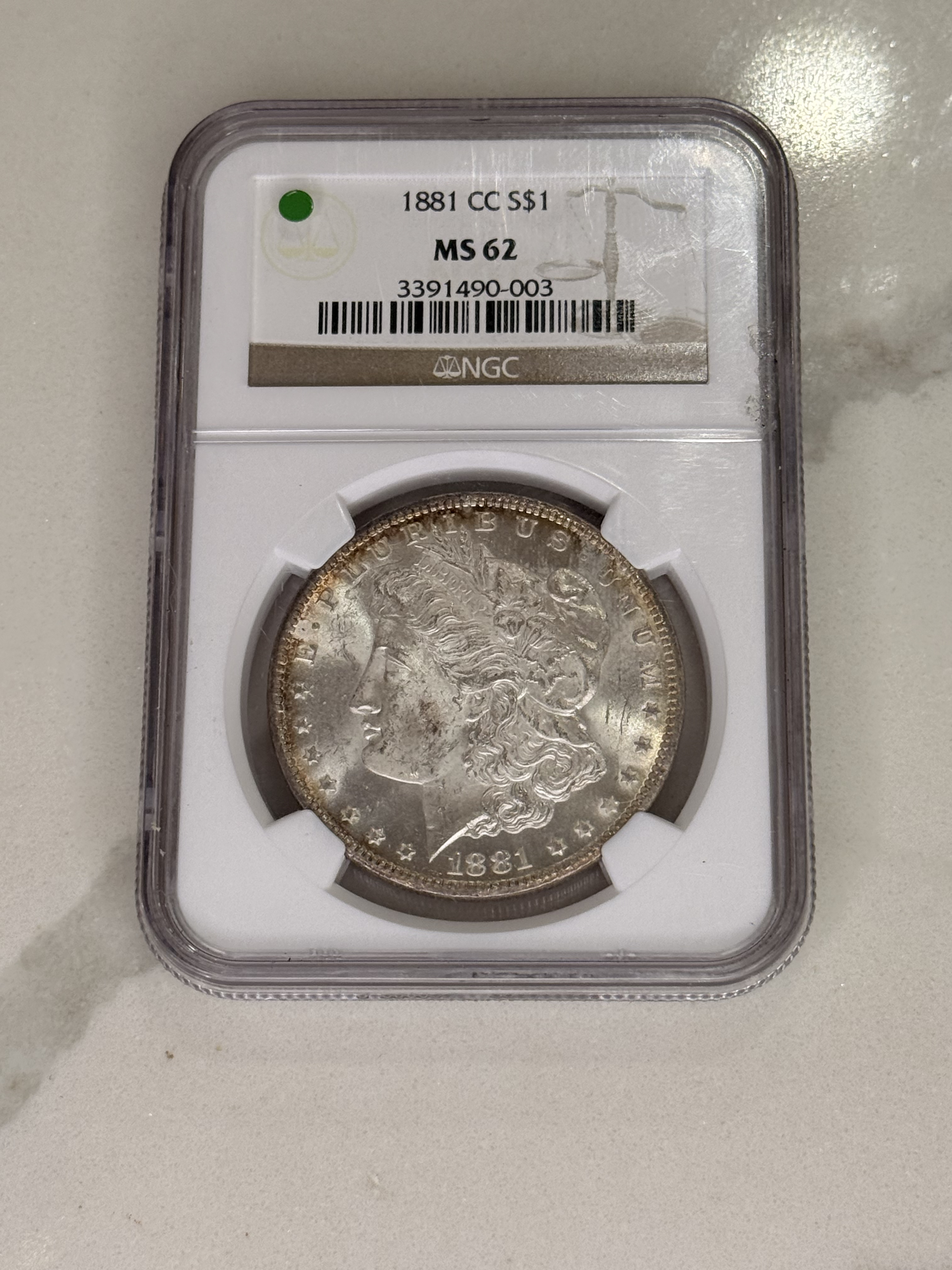 Actual coin and holder — front