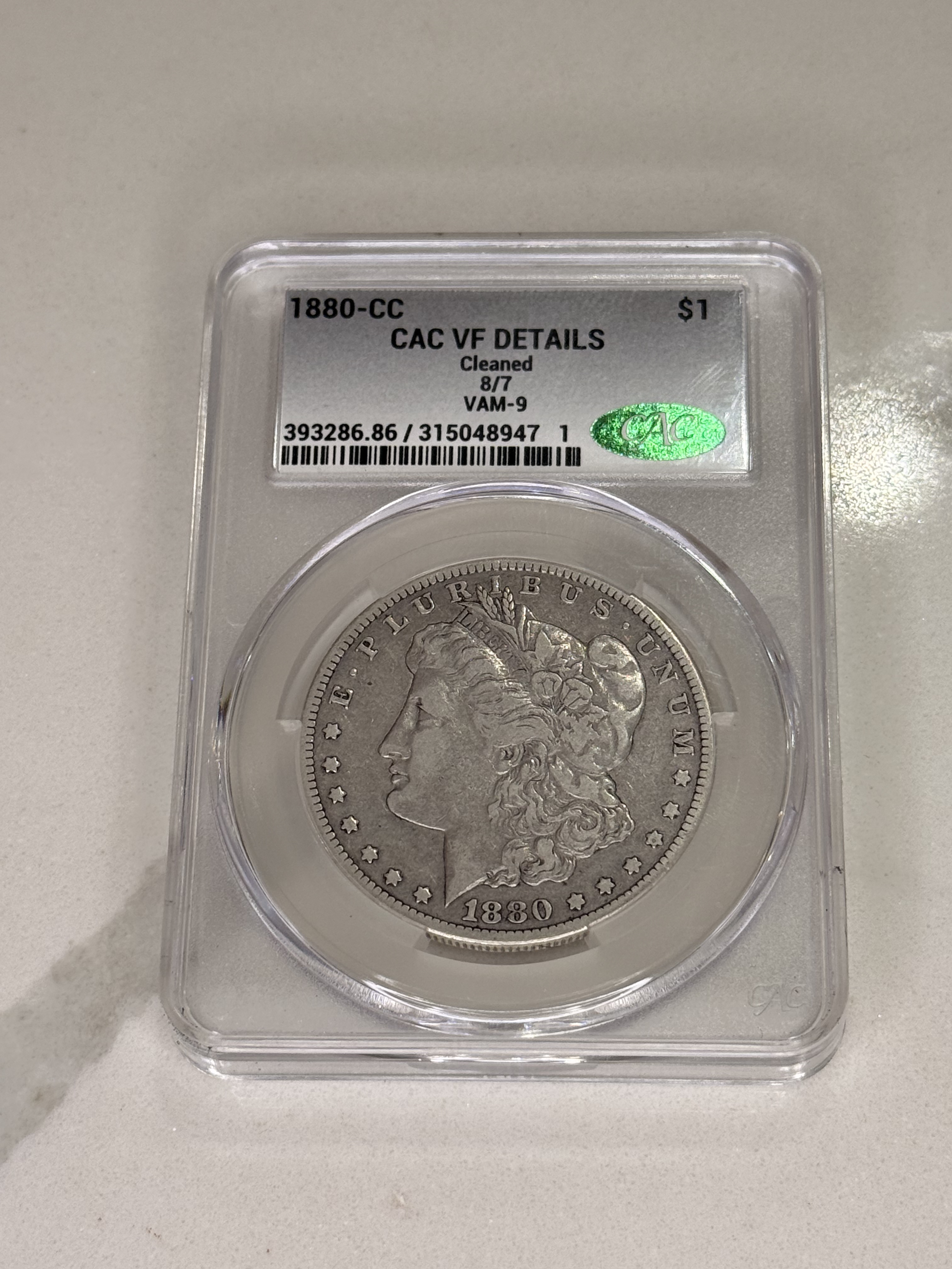 Actual coin and holder — front