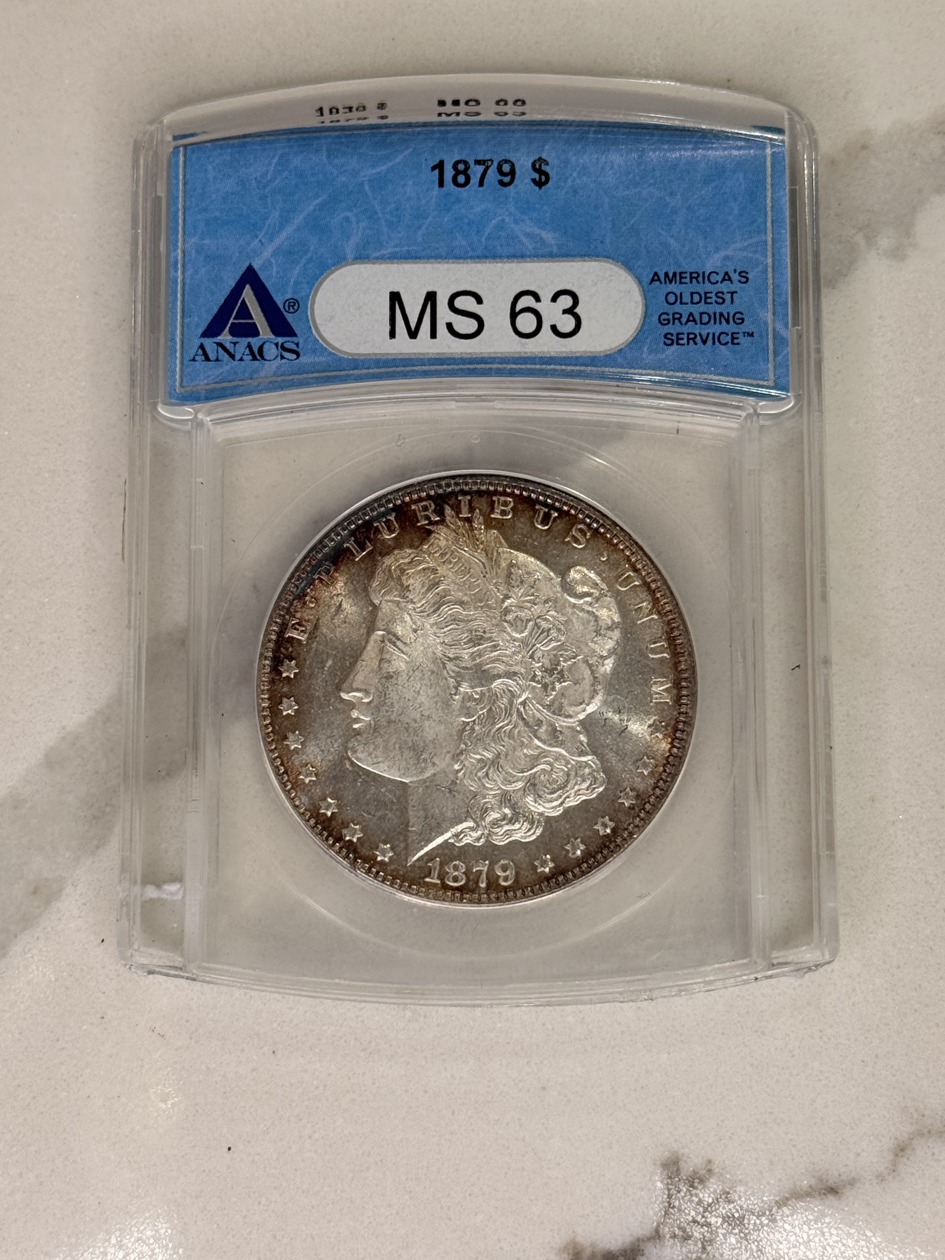 Actual coin and holder — front