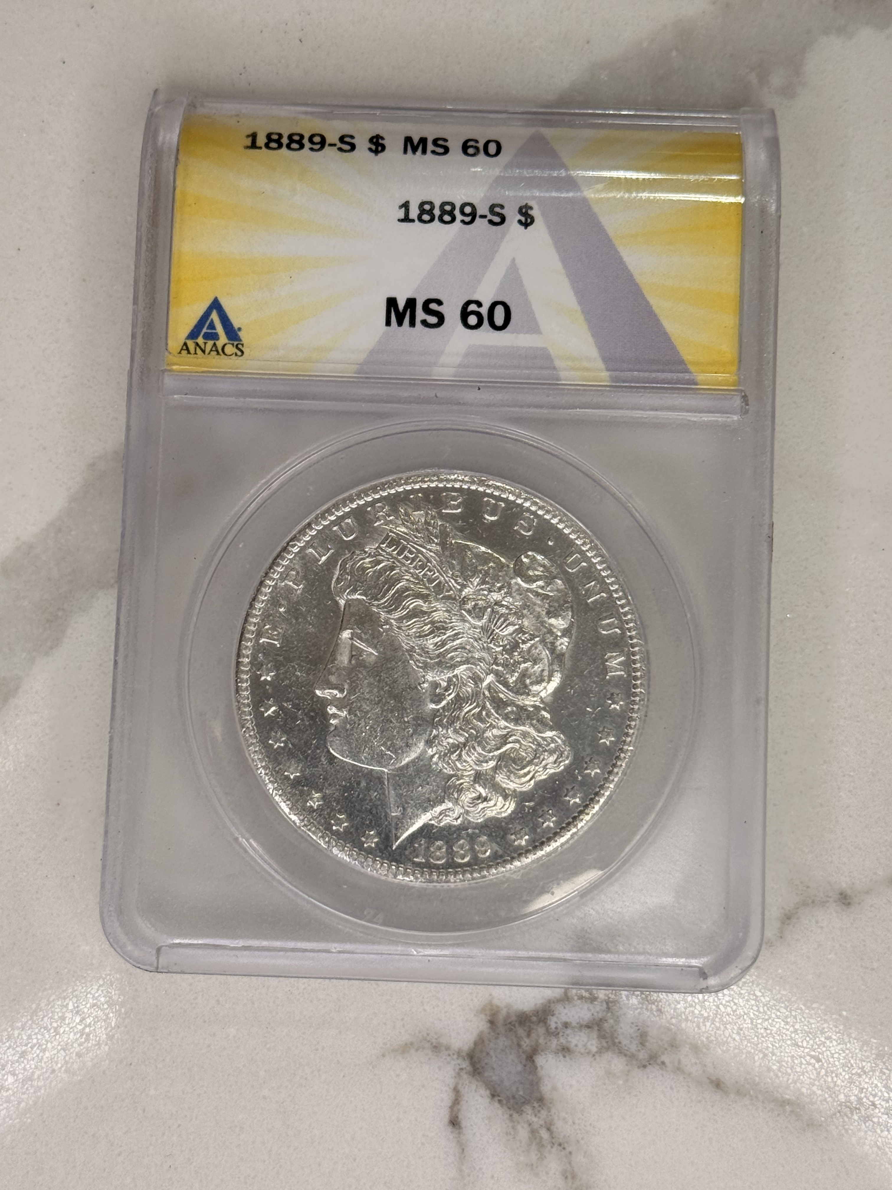 Actual coin and holder — front