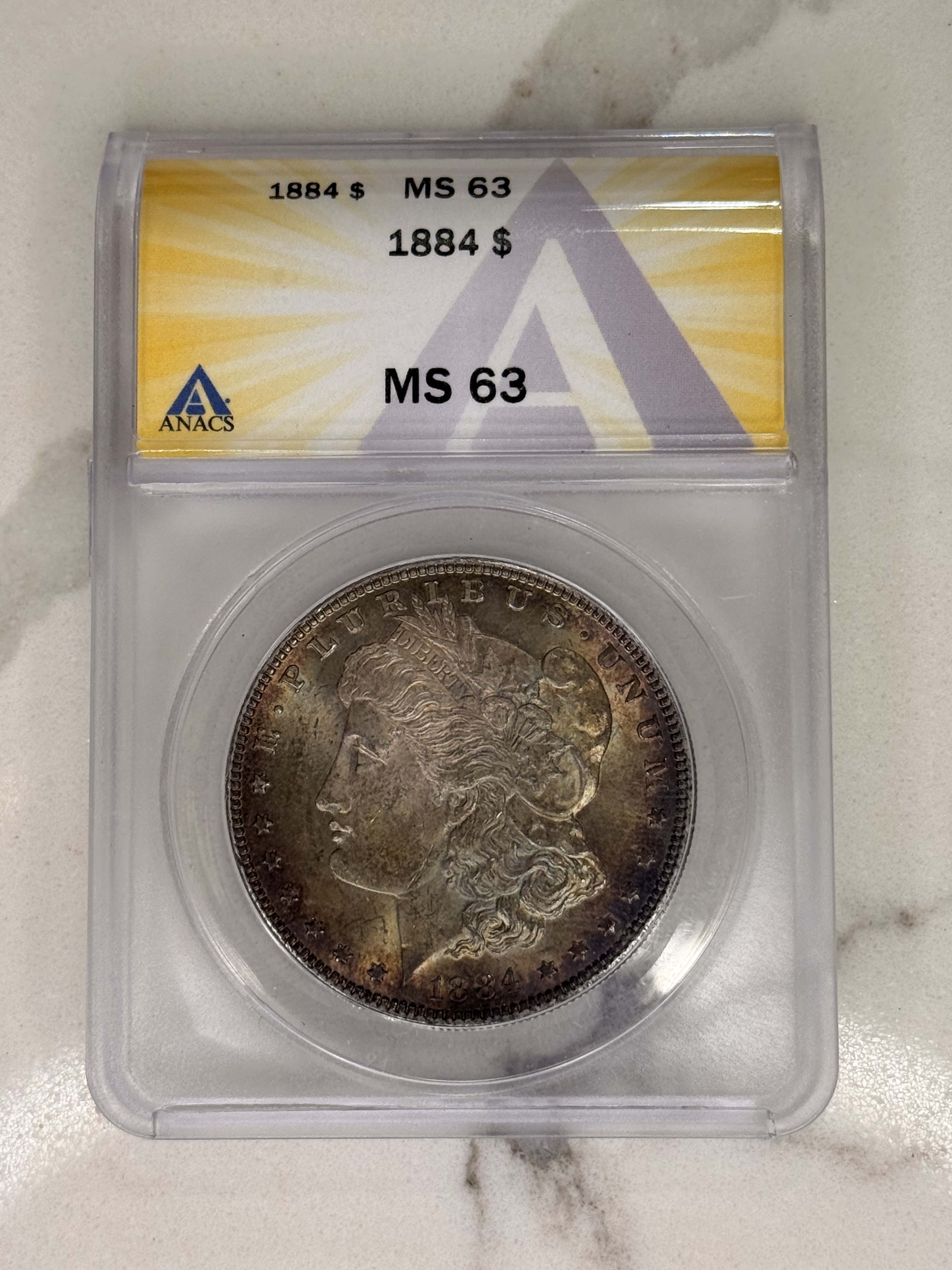 Actual coin and holder — front