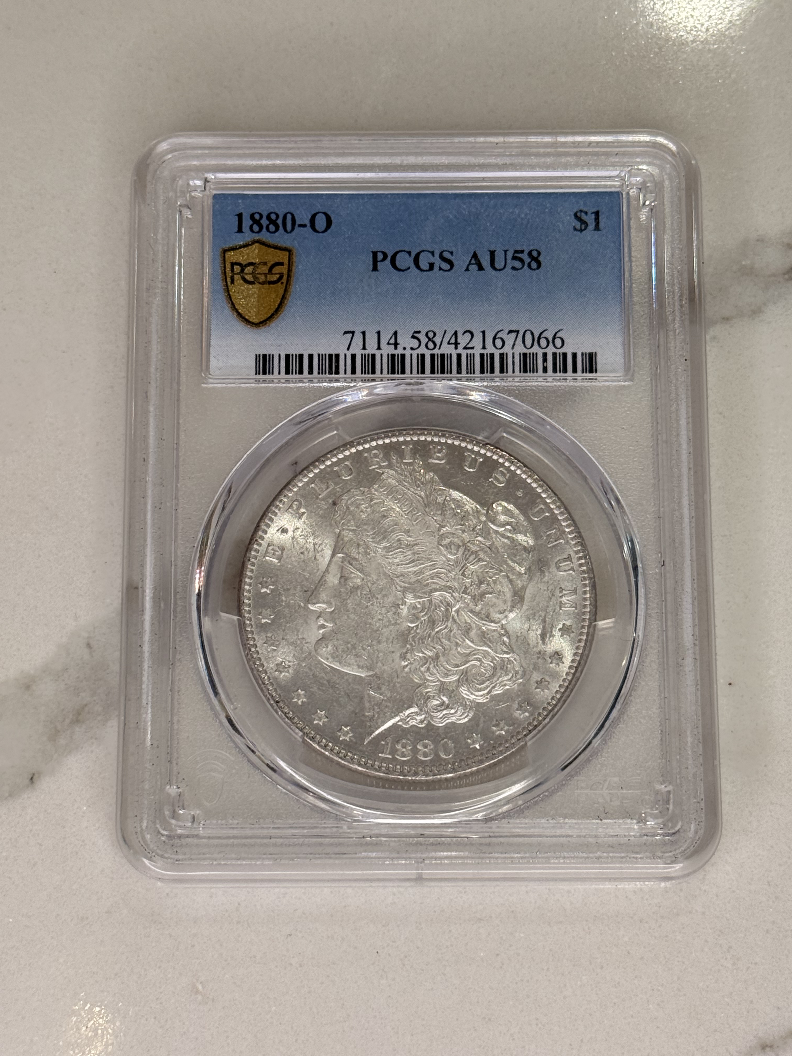 Actual coin and holder — front