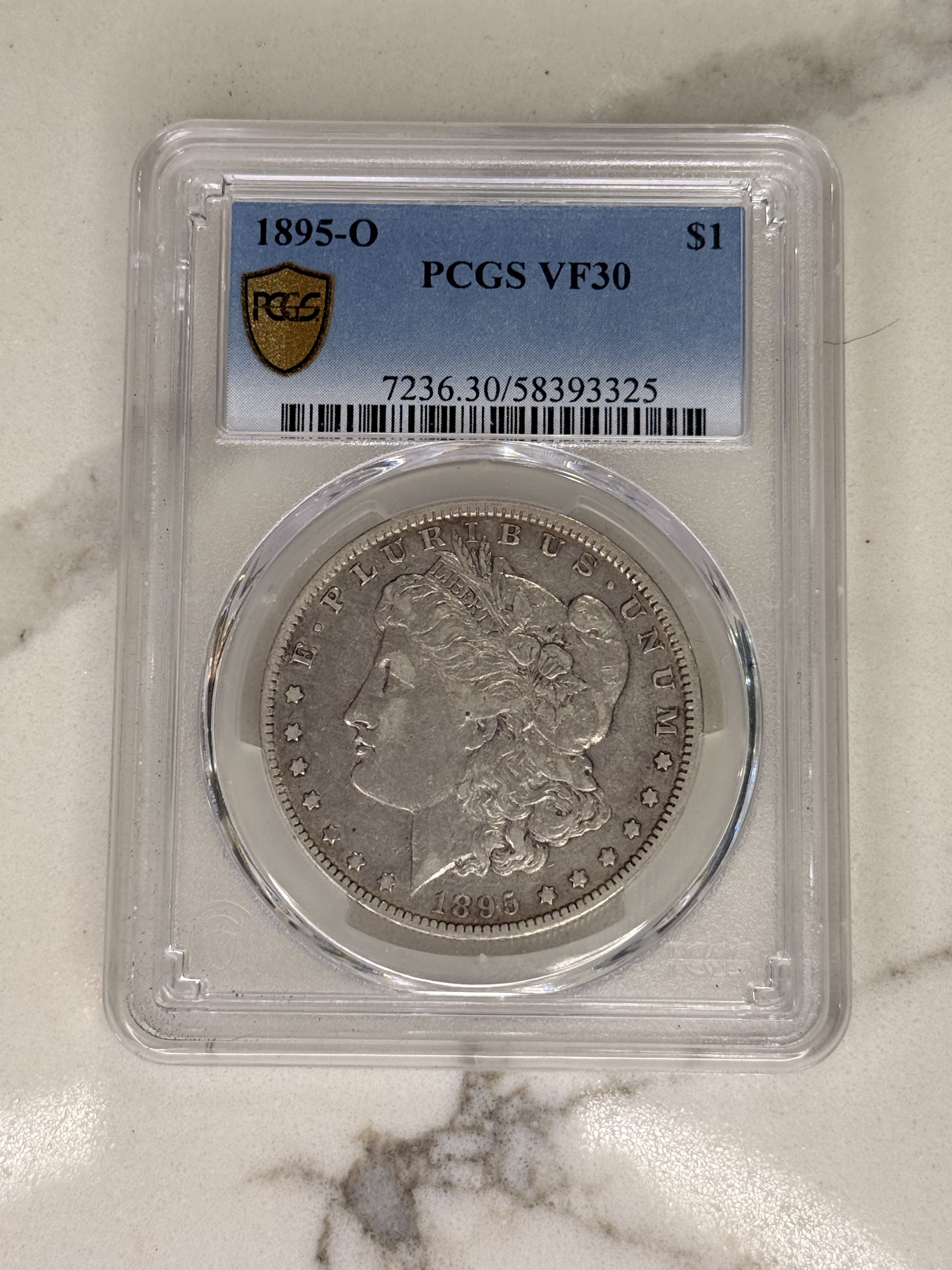 Actual coin and holder — front