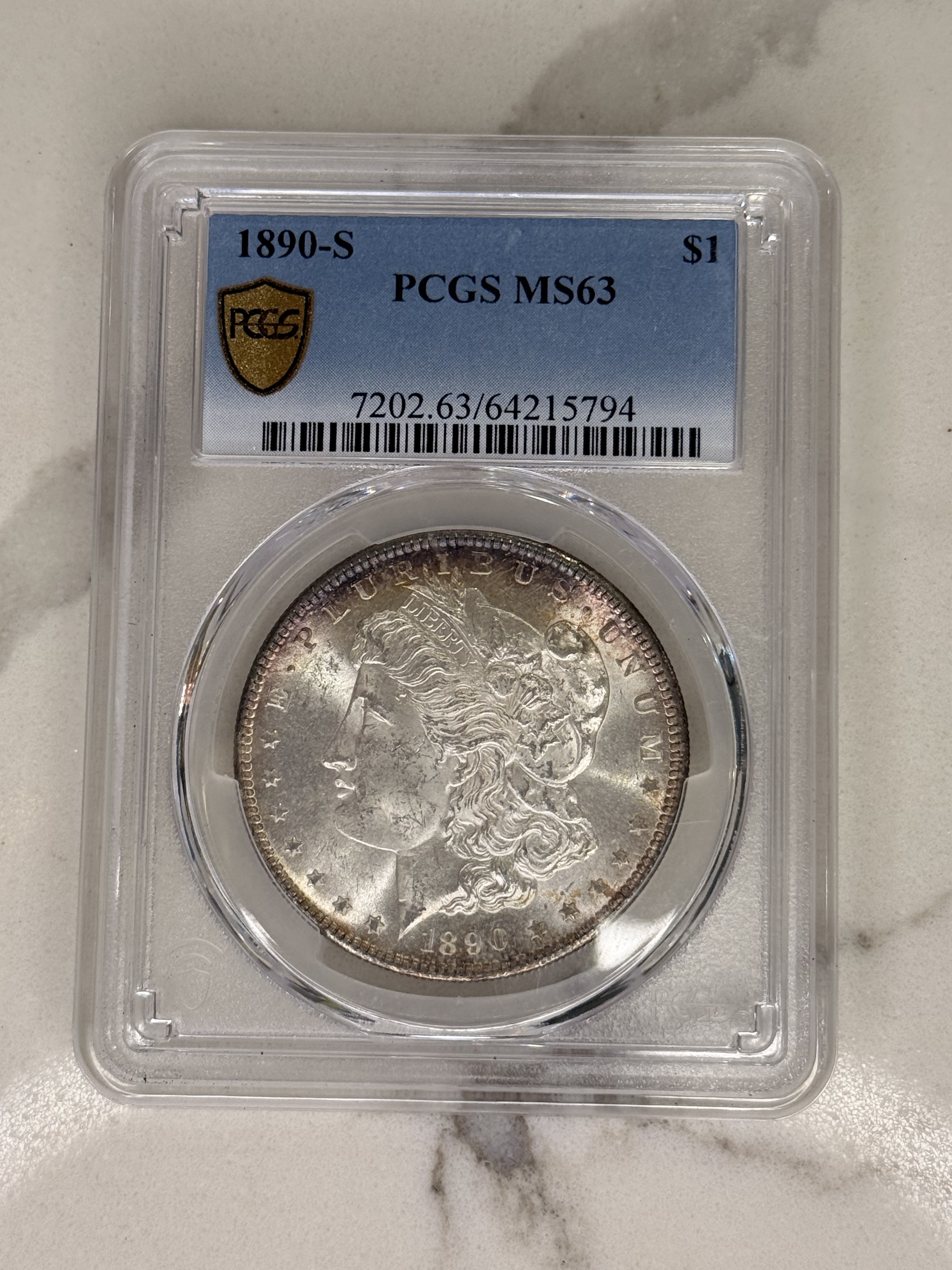 Actual coin and holder — front