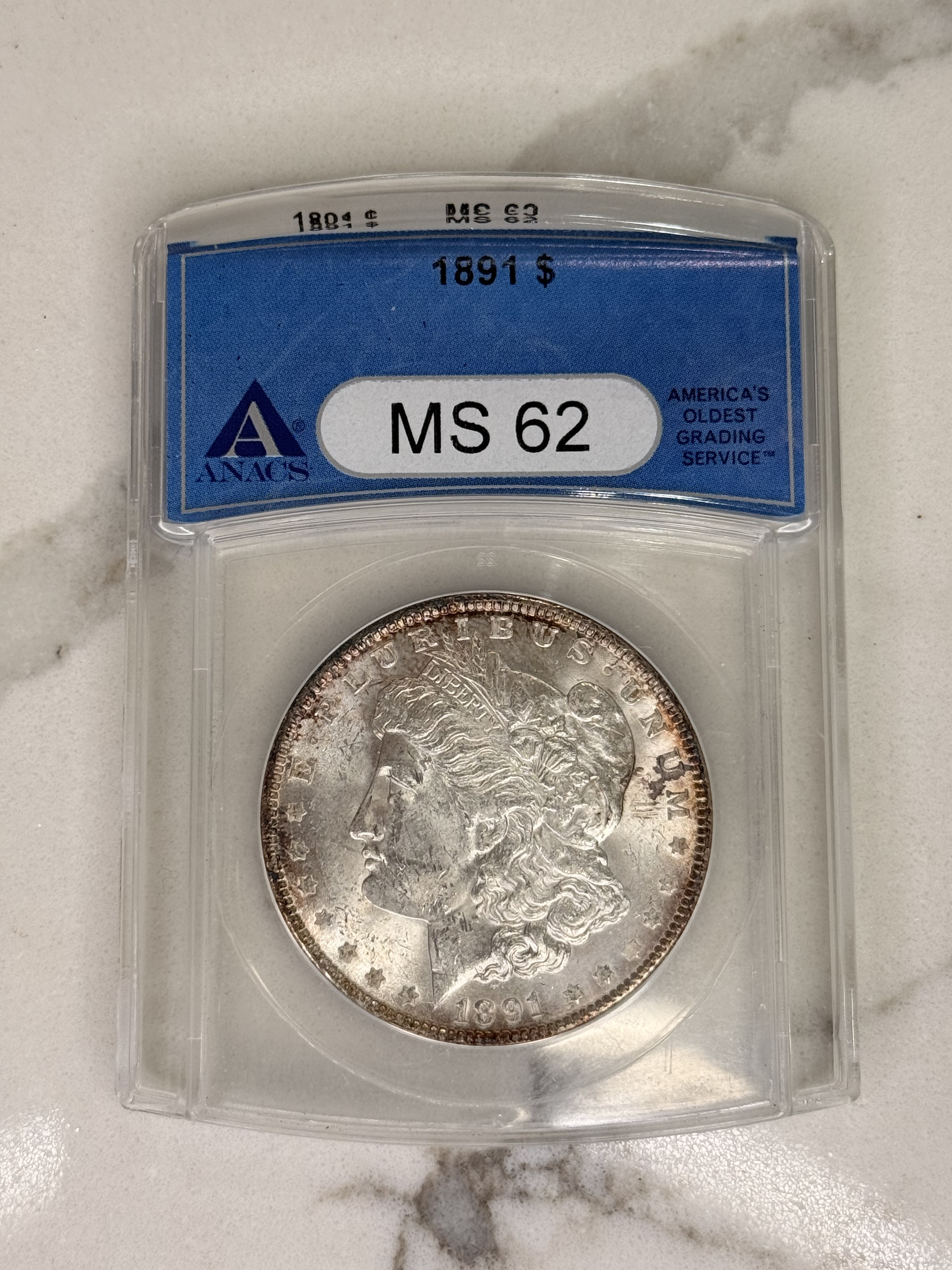 Actual coin and holder — front