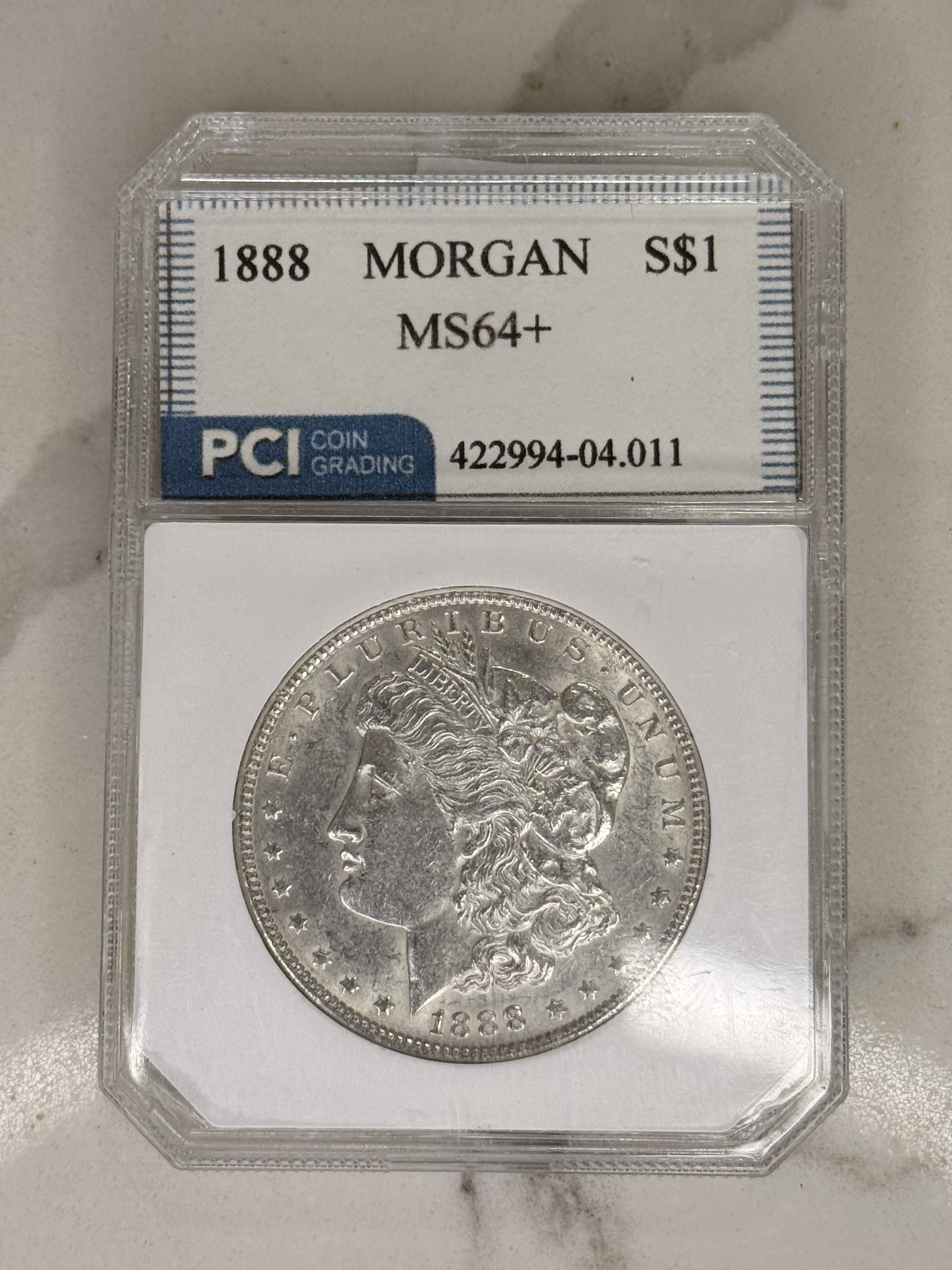 Actual coin and holder — front