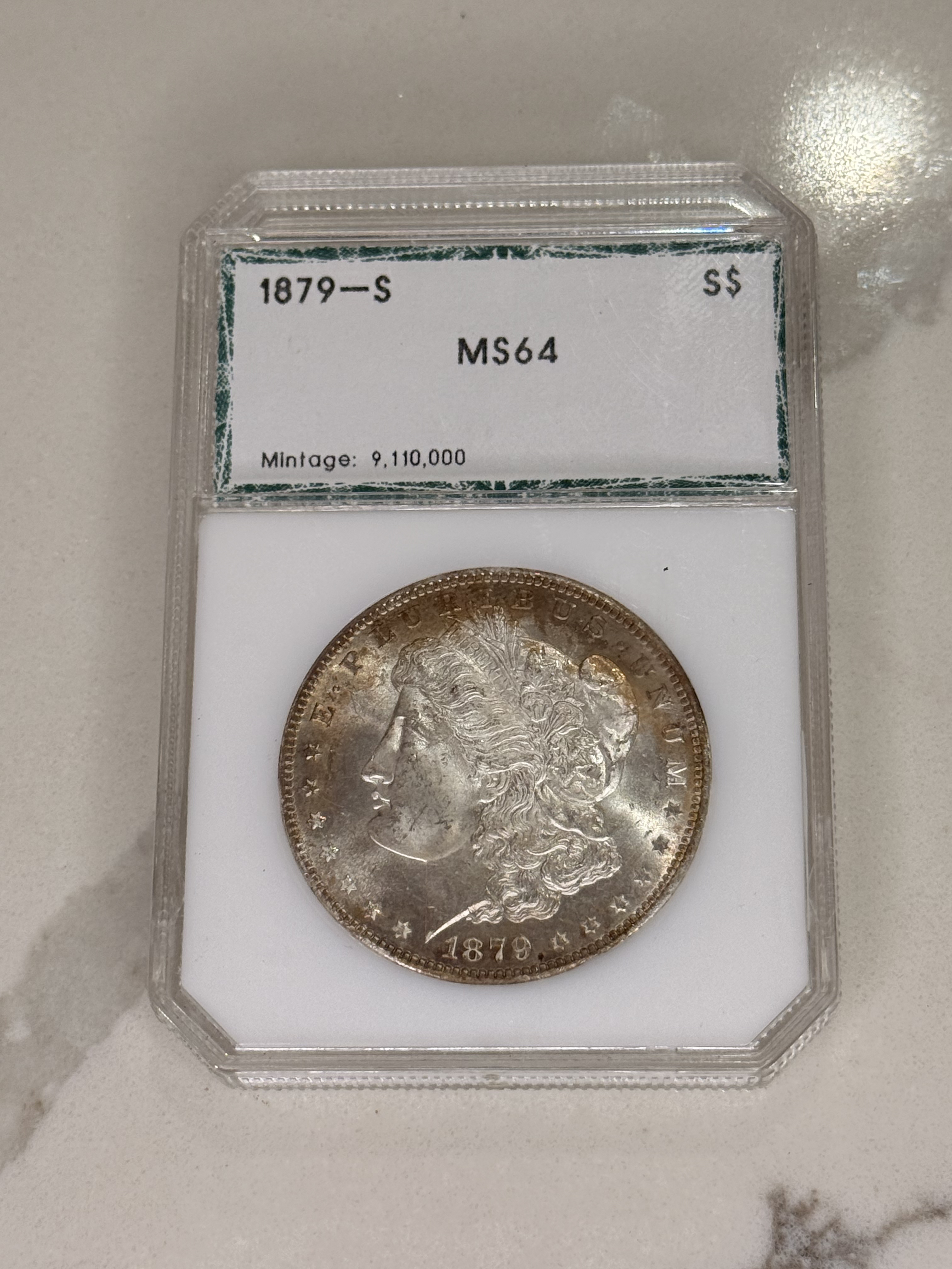Actual coin and holder — front