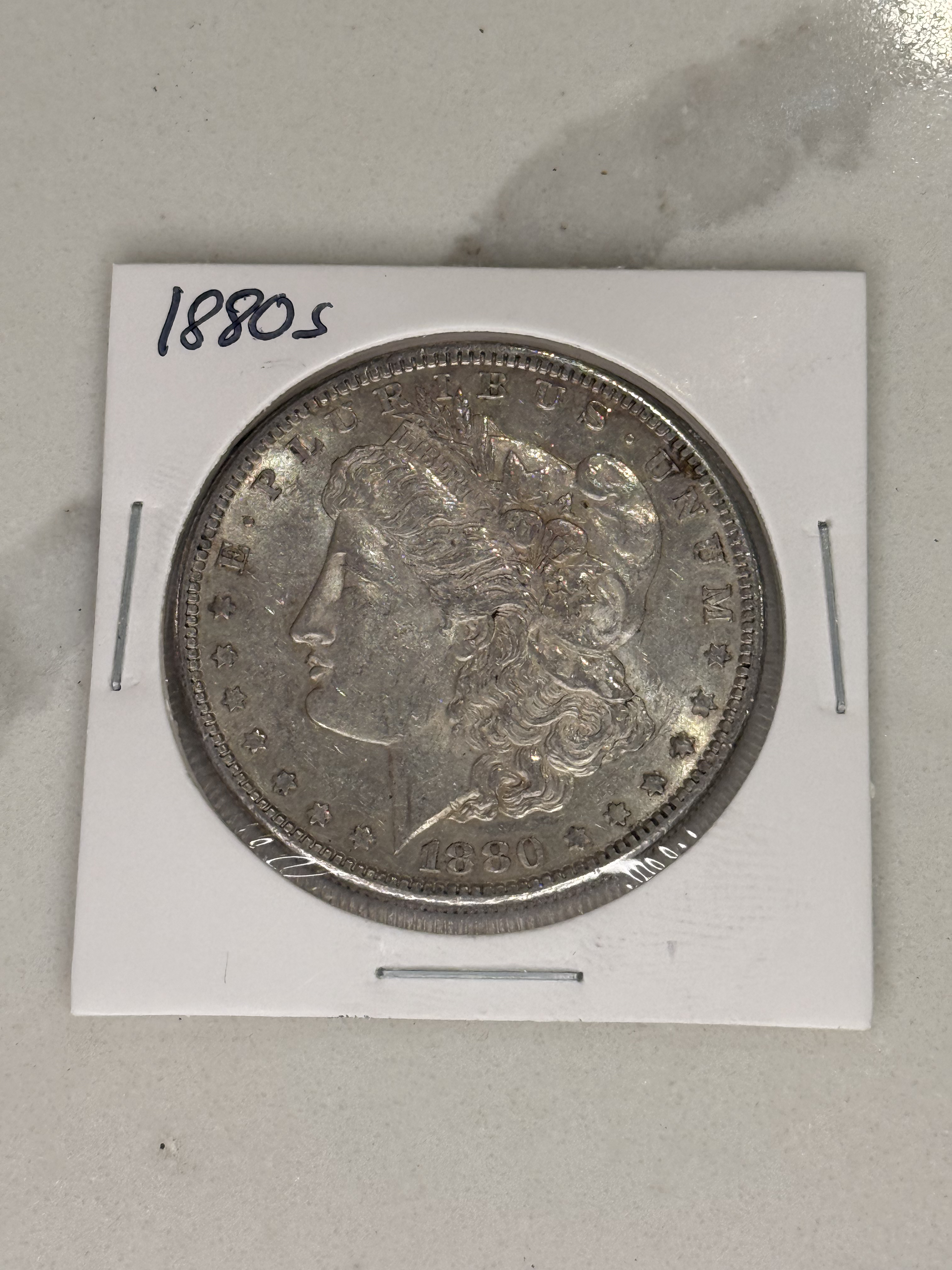 Actual coin and holder — front