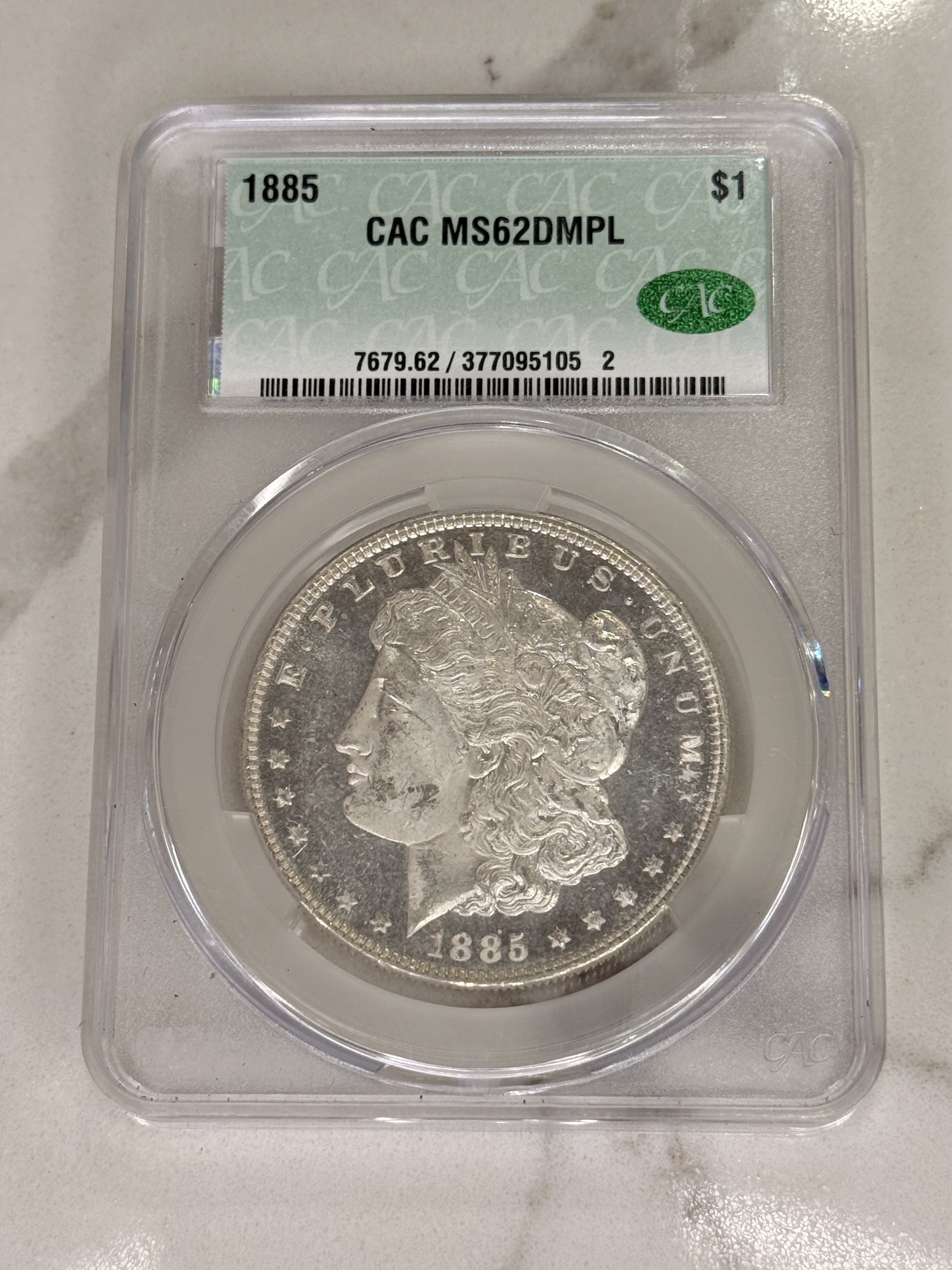 Actual coin and holder — front