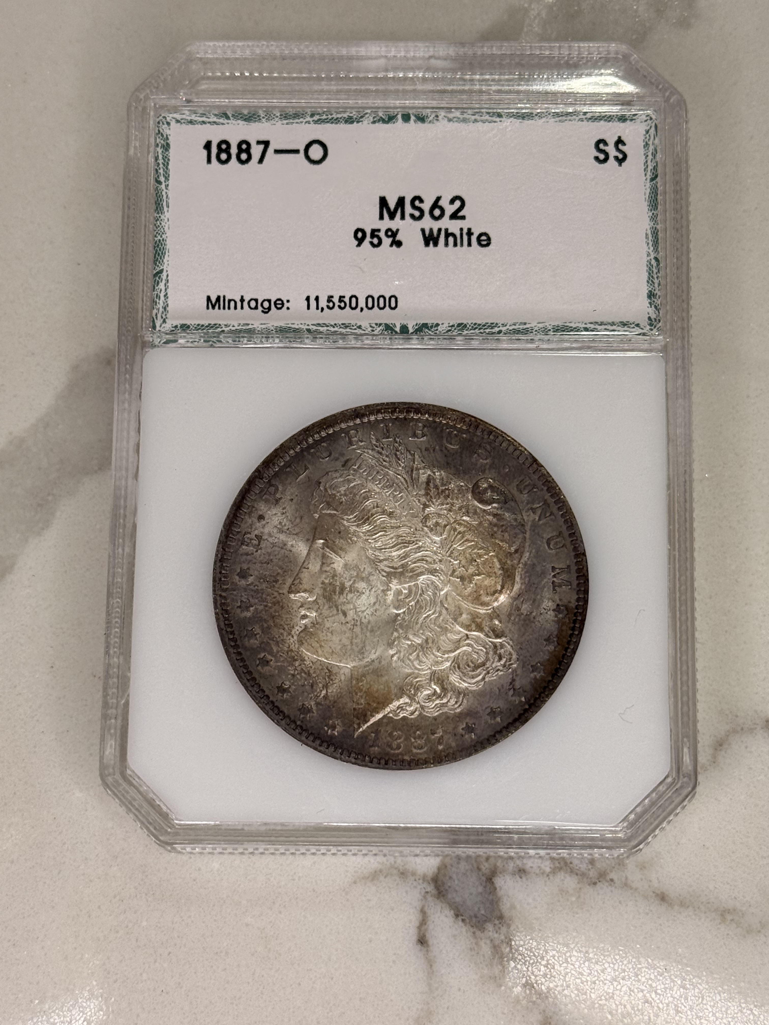 Actual coin and holder — front